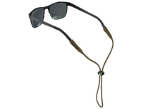 Cablz Mossy Oak silicone eyewear retainer in olive shown fitted to sunglasses