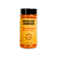 Hardcore Carnivore Hot Honey Butter seasoning, 12.50 oz (354g) shaker. Manufacturer front-label photograph.