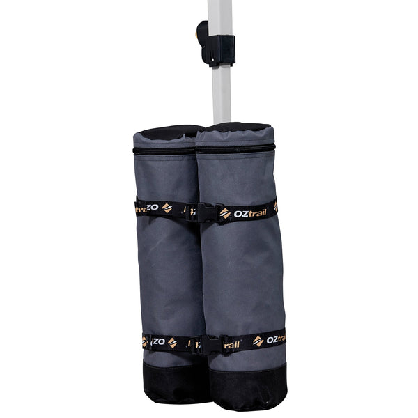 OZtrail single twin-chamber commercial sand bag shown attached to a gazebo leg