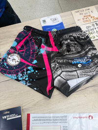 Actual Rod and Rifle pink footy shorts showing bright blue splashes around the pink compass and grey crocodile artwork